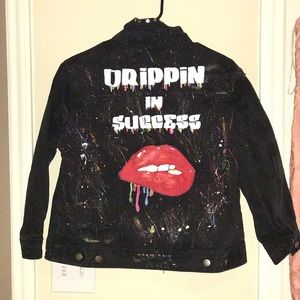 Distressed black denim painted jacket.